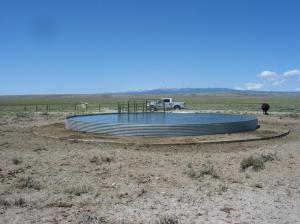 Oregon Slough water tank and electric fence in background